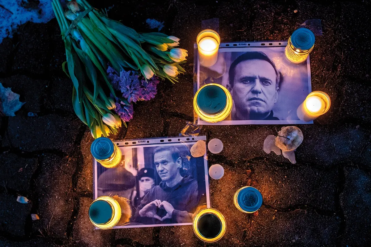 Photos of Russian opposition leader Alexei Navalny, with flowers and candles are laid on a ground in front of the Russian embassy in Vilnius, Lithuania, Friday, Feb. 16, 2024. Navalny, who crusaded against official corruption and staged massive anti-Kremlin protests as President Vladimir Putin\\'s fiercest foe, died Friday in the Arctic penal colony where he was serving a 19-year sentence, Russia\\'s prison agency said. He was 47. (AP Photo/Mindaugas Kulbis) Associated Press/LaPresse Only Italy and Spain , APN