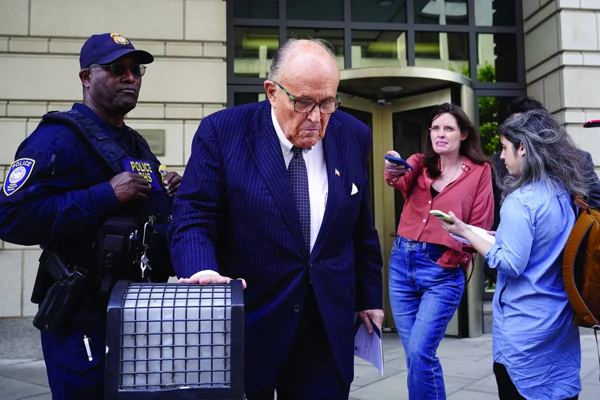 FILE - Former New York City Mayor Rudy Giuliani departs the federal courthouse, Friday, May 19, 2023, in Washington. A review panel says former New York Mayor Rudolph Giuliani should be disbarred in Washington for how he handled litigation challenging the 2020 election on behalf of then-President Donald Trump. (AP Photo/Patrick Semansky, File) , AP