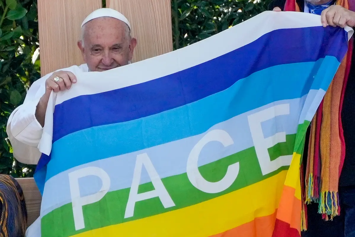 Pope Francis holds a peace flag during the \"Arena of Peace - Justice and Peace Will Embrace\" meeting at Verona\\'s ancient Roman arena, part of his one-day pastoral visit to the northern Italian town of Verona, Saturday, May 18, 2024. (AP Photo/Gregorio Borgia) , APN