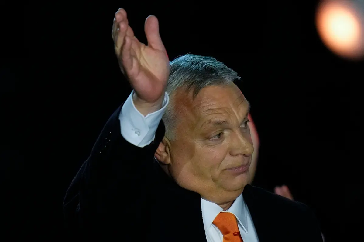 Hungary\\\\\\'s Prime Minister acknowledges cheering supporters during an election night rally in Budapest, Hungary, Sunday, April 3, 2022. Early partial results in Hungary\\\\\\'s national election are showing a strong lead for the right-wing party of pro-Putin nationalist Orban as he seeks a fourth consecutive term. (AP Photo/Petr David Josek) , APN