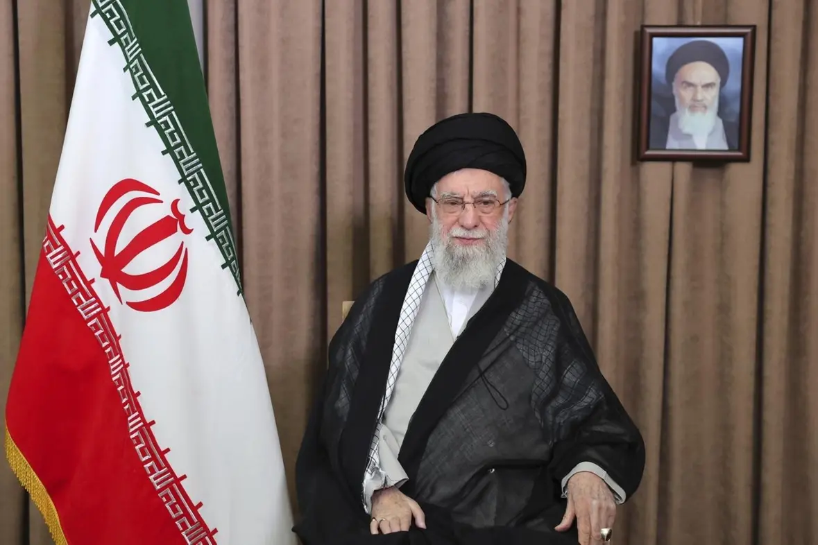 This photo released by an official website of the office of the Iranian supreme leader, shows Supreme Leader Ayatollah Ali Khamenei in a televised speech, under a portrait of the late revolutionary founder Ayatollah Khomeini, Friday, June 13, 2025. (Office of the Iranian Supreme Leader via AP) , APN