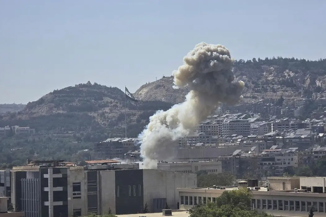 In this photo released by the Syrian official news agency SANA, smoke rises from an Israeli airstrike that hit the Syrian Defense Ministry in Damascus, Syria, Wednesday, July 16, 2025. (SANA via AP) Associated Press / LaPresse Only italy and spain , APN