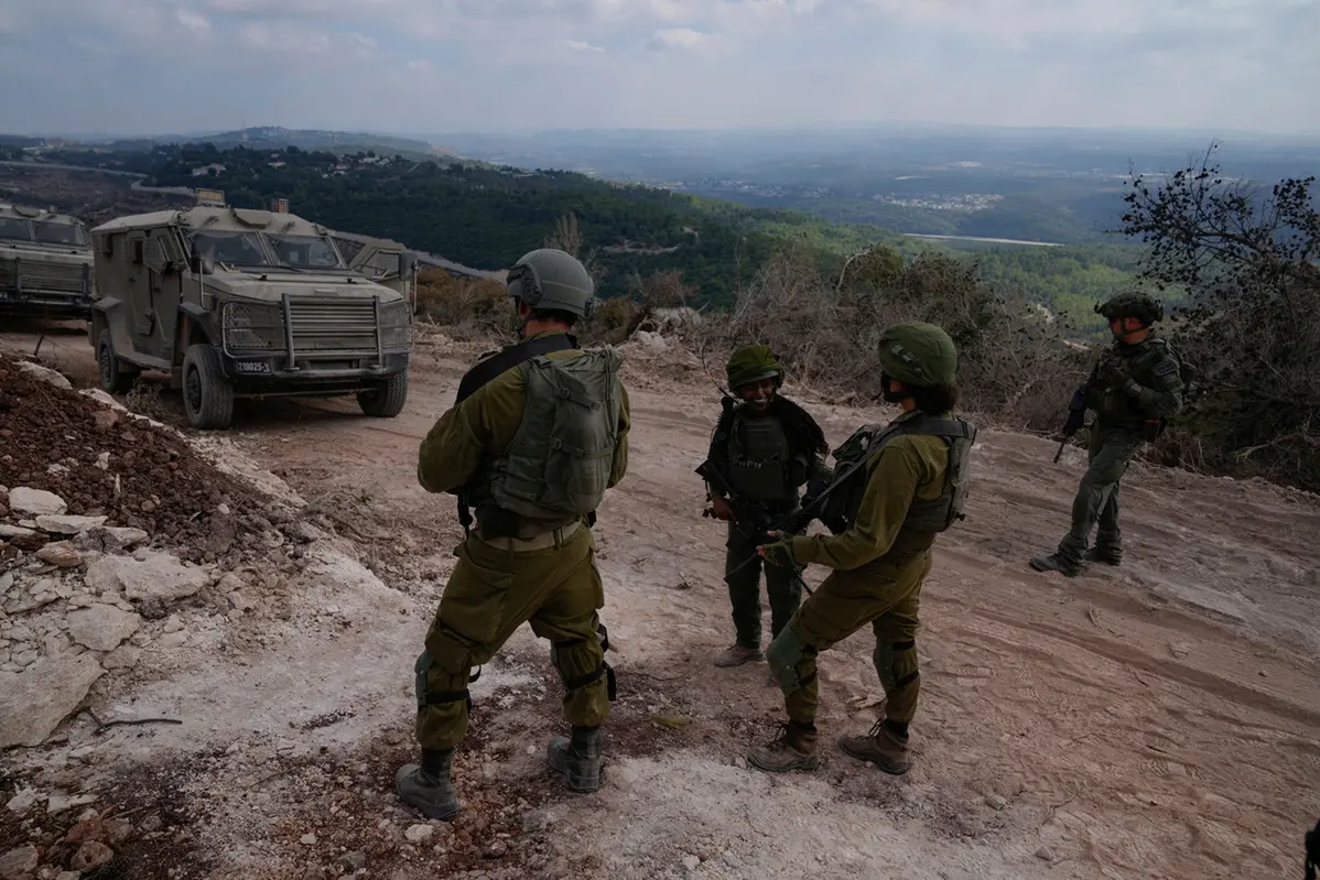 Israeli soldiers are seen during a ground operation in southern Lebanon, near the border with Israel, Sunday, Oct. 13, 2024. (AP Photo/Sam McNeil) , APN