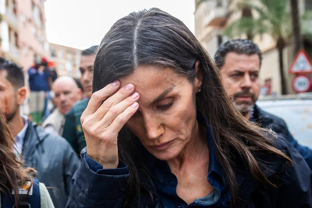 Spain's Queen Letizia reacts as she visits people affected by the floods in Paiporta, near Valencia, Spain, Sunday Nov. 3, 2024. (AP Photo/David Melero)