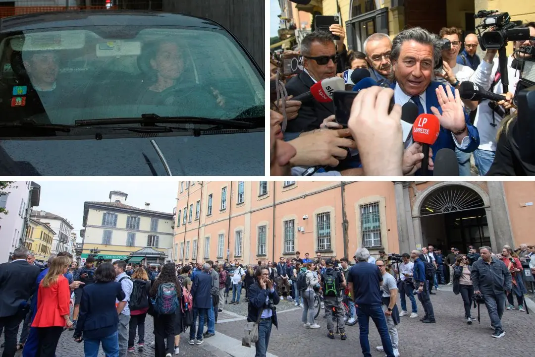 Stasi mentre esce in auto con il suo avvocato, il legale De Rensis e la folla davanti alla Procura di Pavia