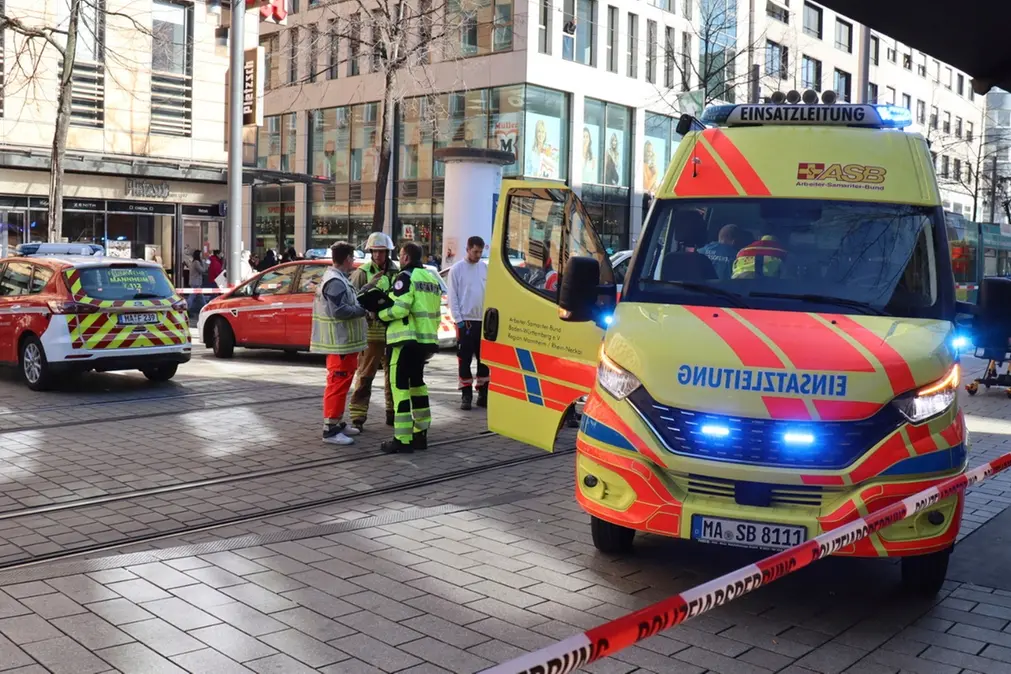 Emergency services and police stand at Paradeplatz in Mannheim, Germany, Monday March 3, 2025, after a driver driver drove into a group of people in a pedestrian street in Mannheim, killing one person and injuring others, Germany police said. (Ren\\u00E9 Priebe/dpa via AP)(Ren\\u00E9 Priebe/dpa via AP) , APN