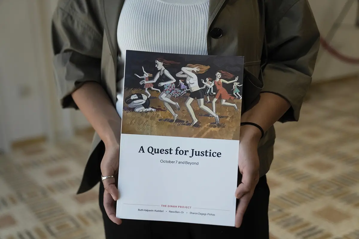 A copy of the report by the Dinah Project on sexual violence committed on Oct. 7, 2023 by Hamas is displayed by a journalist before a ceremony presenting the report to Israel\\'s first lady Michal Herzog in Jerusalem, Tuesday, July 8, 2025. (AP Photo/Maya Alleruzzo) Associated Press / LaPresse Only italy and spain , APN