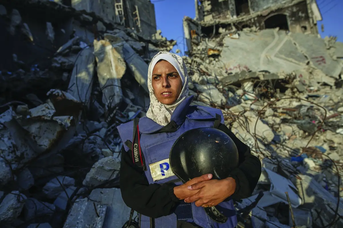 Freelance journalist Mariam Dagga, 33, who had been working with the Associated Press and other outlets since the start of the Gaza war, poses for a portrait in Khan Younis, southern Gaza Strip, June 14, 2024. She was among eight people, including four journalists, killed Monday in an Israeli strikes on Nasser Hospital in Khan Younis. (AP Photo/Jehad Alshrafi) , APN