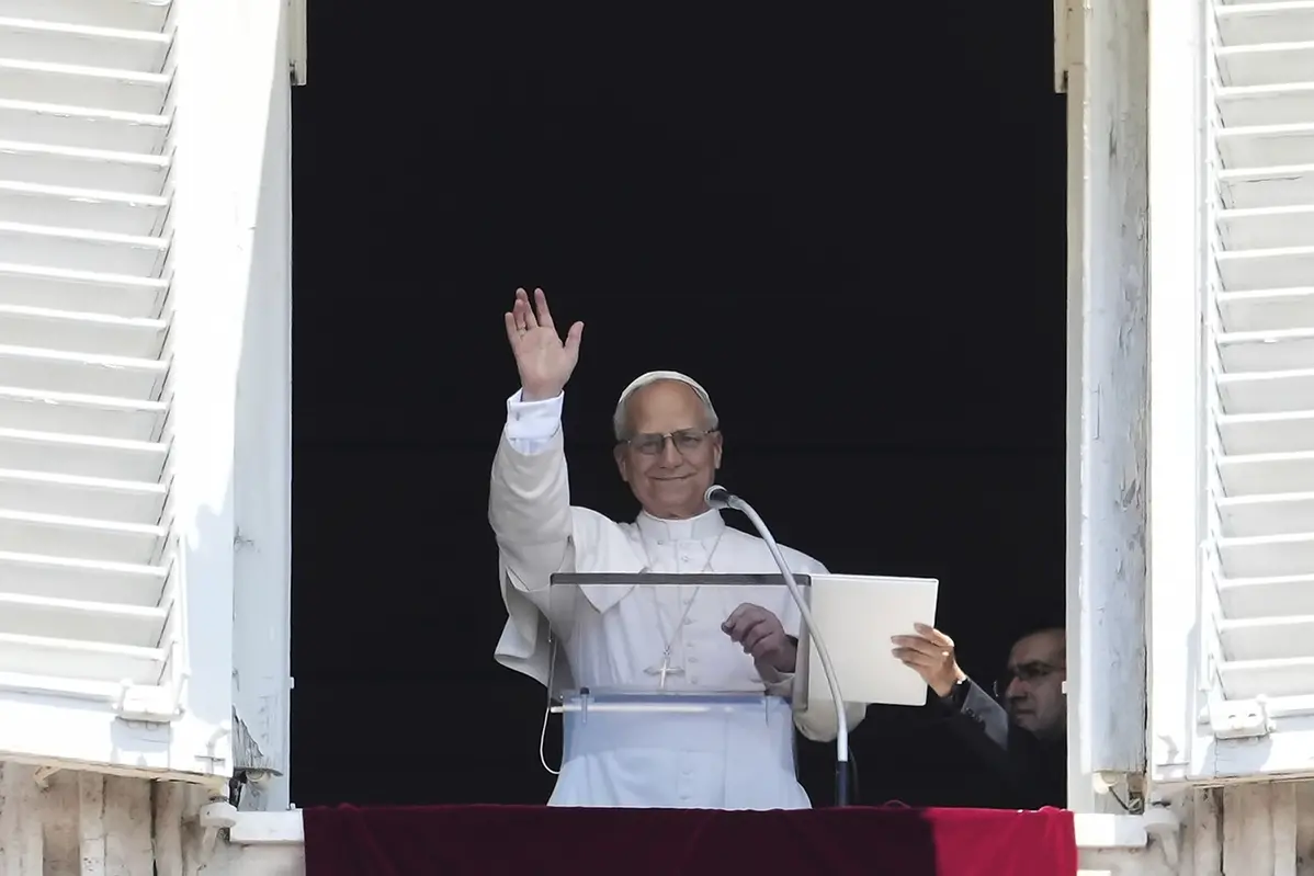 Pope Leo XIV appears at his studio\\'s window to bless the faithful gathered in St. Peter\\'s Square at the Vatican for the Angelus prayer, Sunday. (AP Photo/Andrew Medichini) , APN
