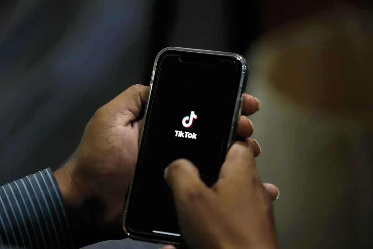 A man opens social media app \\'Tik Tok\\' on his cell phone, in Islamabad, Pakistan, Tuesday, July 21, 2020. Pakistan has threatened the China-linked TikTok video service and blocked the Singapore-based Bigo Live streaming platform, citing what the regulating authority called widespread complaints about \"immoral, obscene and vulgar\" content. (AP Photo/Anjum Naveed) , AP