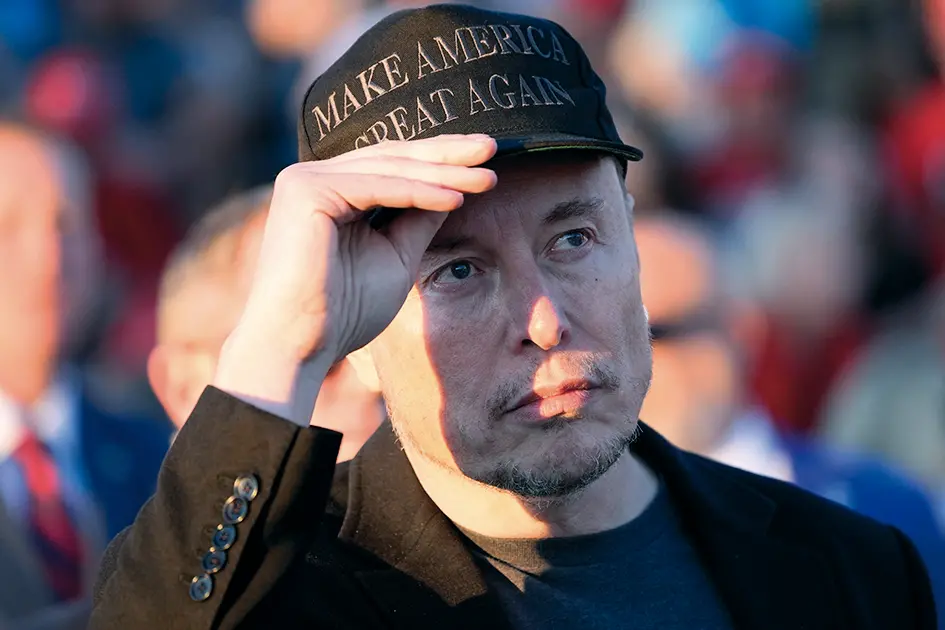 Tesla and SpaceX CEO Elon Musk listens as Republican presidential nominee former President Donald Trump speaks at a campaign event at the Butler Farm Show, Saturday, Oct. 5, 2024, in Butler, Pa. (AP Photo/Alex Brandon) Associated Press/LaPresse , APN