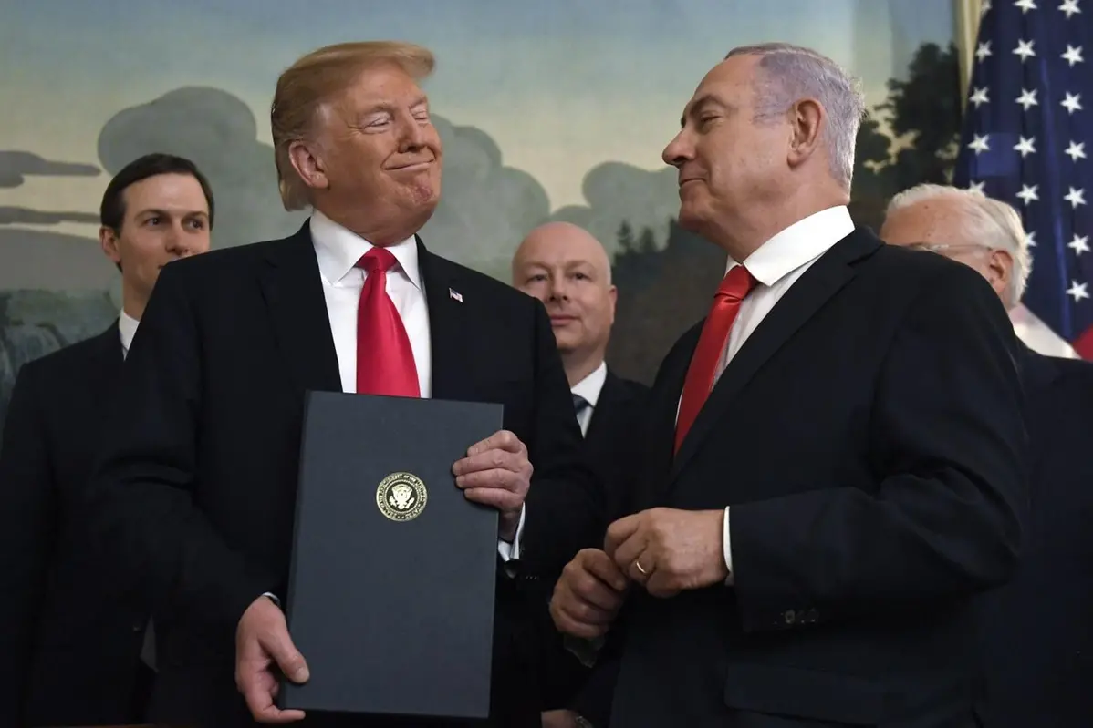 FILE - In this March 25, 2019 file photo, President Donald Trump smiles at Israeli Prime Minister Benjamin Netanyahu, right, after signing a proclamation at the White House in Washington. (AP Photo/Susan Walsh, File) , AP