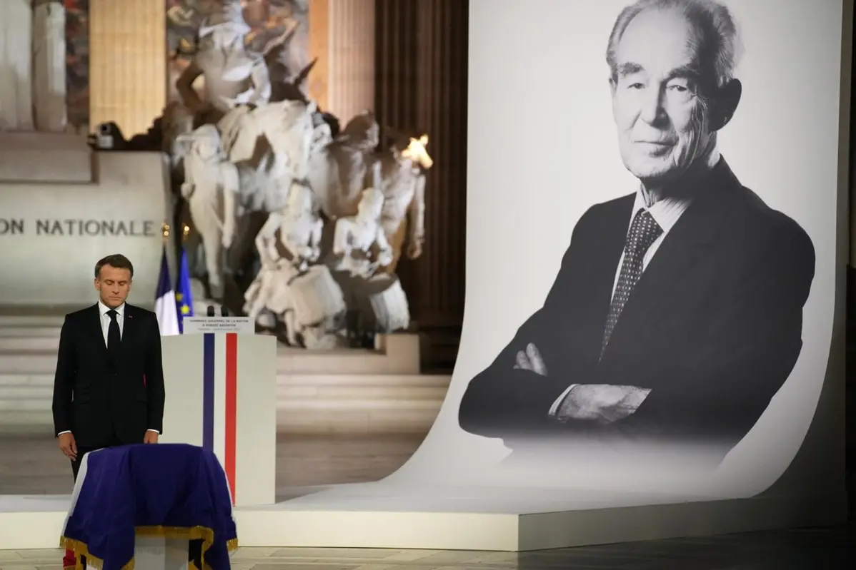 French President Emmanuel Macron pays his respects to late Robert Badinter, a revered rights defender who spearheaded France\\'s drive to end the death penalty, during his indiction ceremony at the Pantheon monument , Thursday, Oct. 9, 2025 in Paris. (AP Photo/Christophe Ena, Pool) , AP