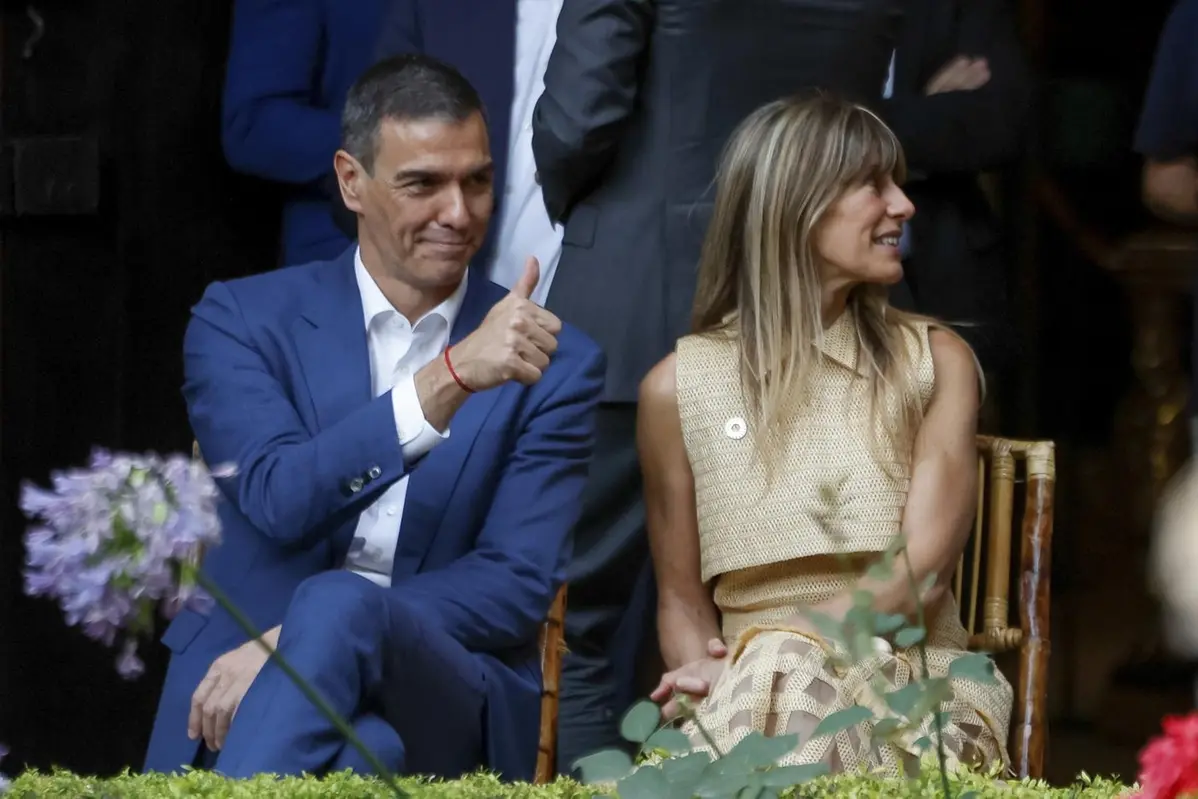 Spain\\'s Prime Minister Pedro Sanchez gestures next to his wife Begona Gomez before a dinner at the U.N. financing for development meeting in Seville, Spain, Monday June 30, 2025. (Juanjo Martin/Pool photo via AP) , AP