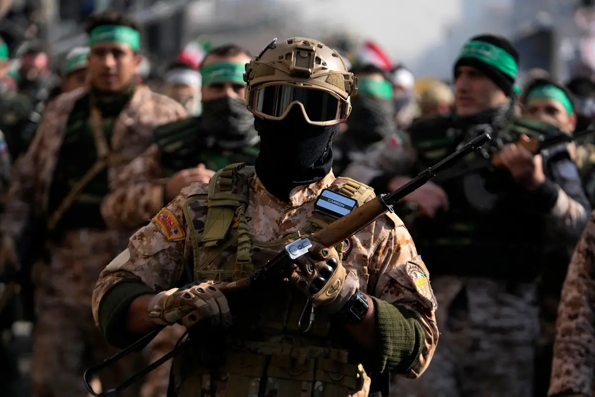 Members of the Iranian Basij paramilitary force march during the force parade in Tehran, Iran, Friday, Jan. 10, 2025. (AP Photo/Vahid Salemi) , APN