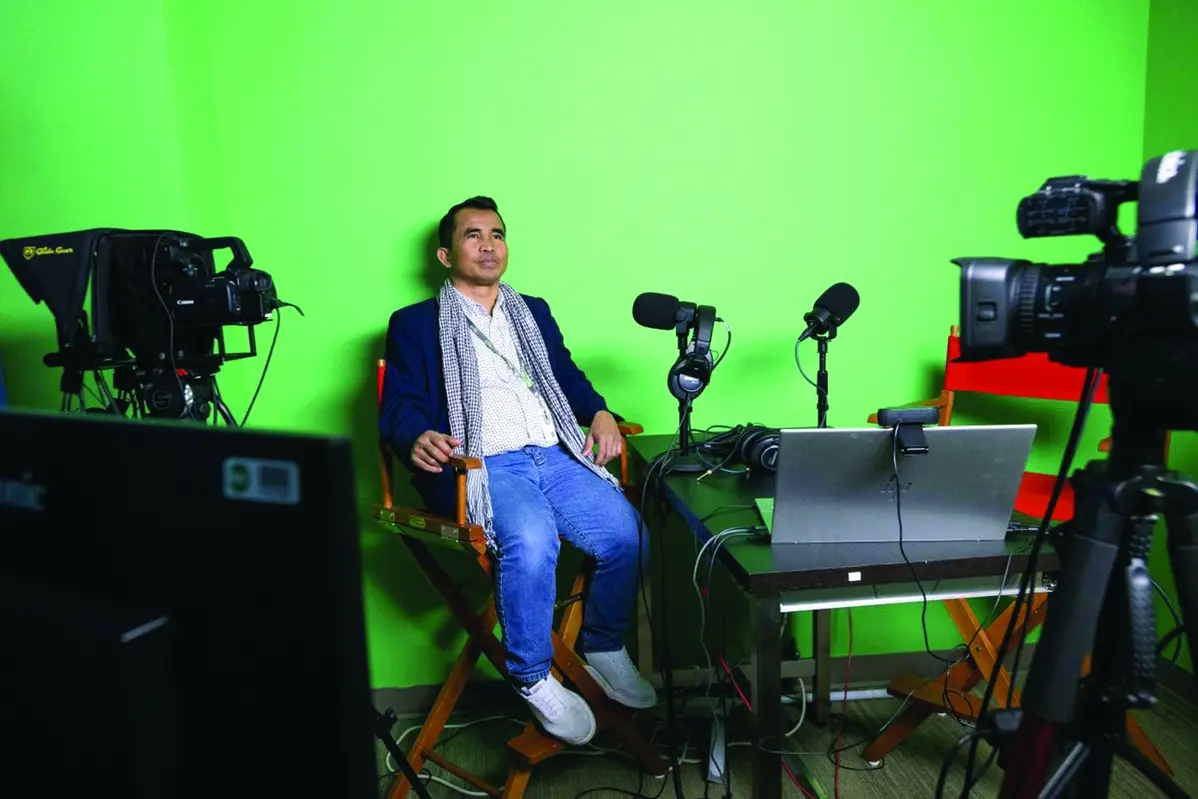 Hour Hum, a Cambodian reporter at Radio Free Asia who spent 7 years in a Thai refugee camp before arriving in the United States, poses for a portrait in the podcast room, Tuesday, April 1, 2025, at the RFA office in Washington. (AP Photo/Rod Lamkey, Jr.) , AP