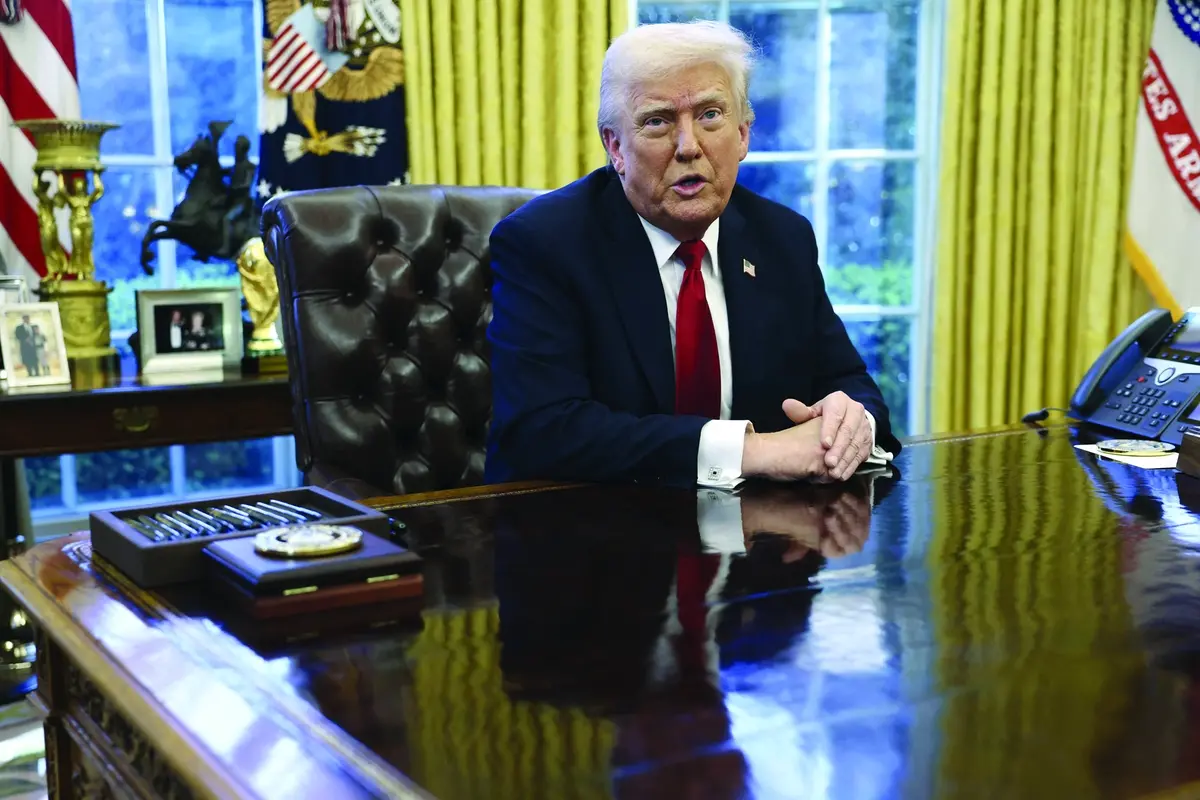 President Donald Trump speaks to reporters in the Oval Office at the White House in Washington, Wednesday, March 26, 2025. (Pool via AP) , APN