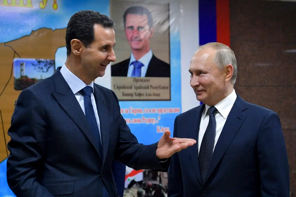 FILE - Syrian President Bashar Assad, left, gestures while speaking to Russian President Vladimir Putin during their meeting in Damascus, Syria, Jan. 7, 2020. (Alexei Druzhinin, Sputnik, Kremlin Pool Photo via AP, File) , APN