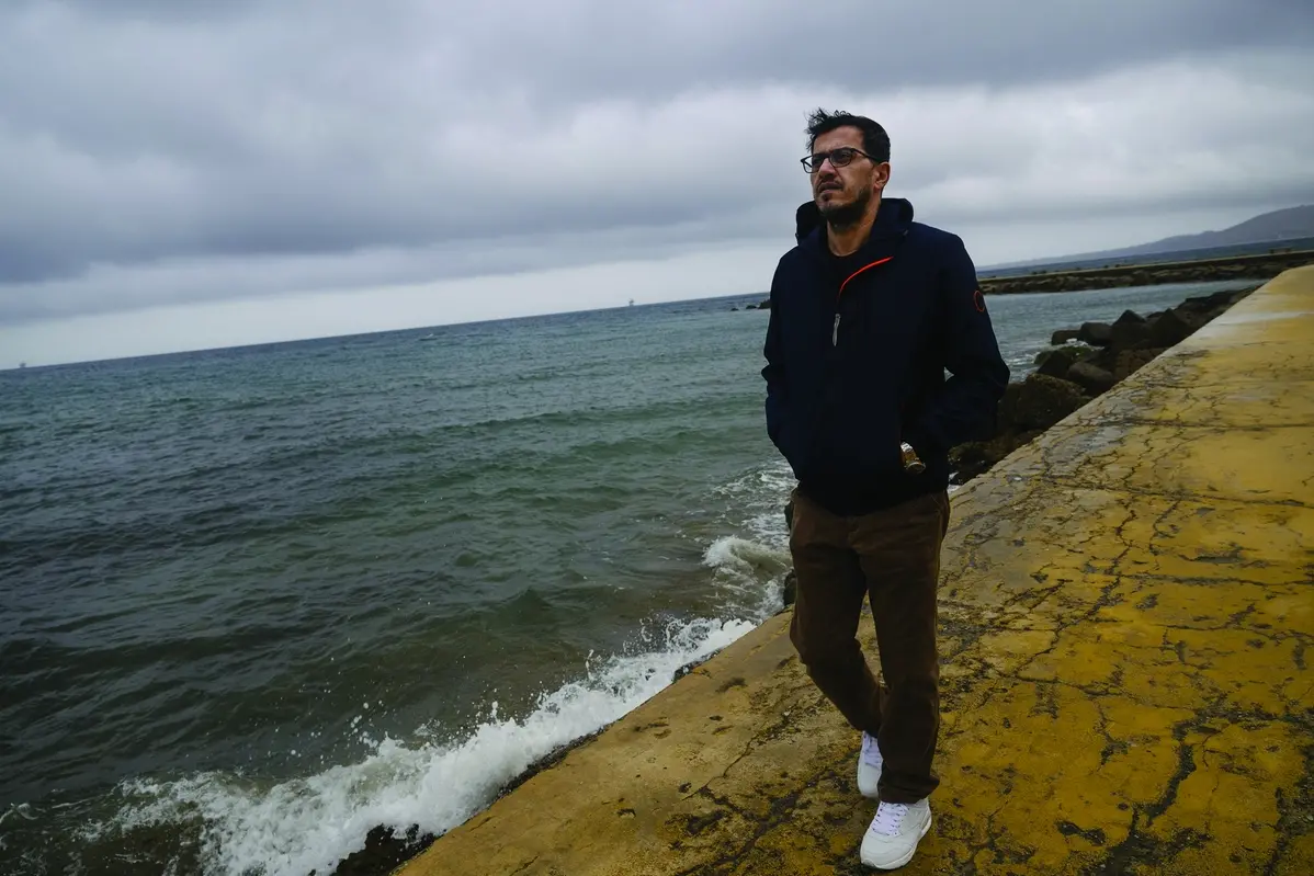 Mojtaba Rezapour Moghaddam, 47, from Mashad, Iran, walks on a pier in Crotone, southern Italy, Saturday, Feb. 24, 2024. Moghaddam survived a shipwreck when a migrant boat capsized in the early morning of Sunday, Feb. 26, 2023, at a short distance from the shore in Steccato di Cutro, near Crotone in the Italian southern tip, killing at least 94 people. Survivors and family members of the victims are converging in the area for a commemoration on Monday, Feb. 26, 2024, on the first anniversary of the disaster. (AP Photo/Valeria Ferraro) Associated Press/LaPresse Only Italy and Spain , APN