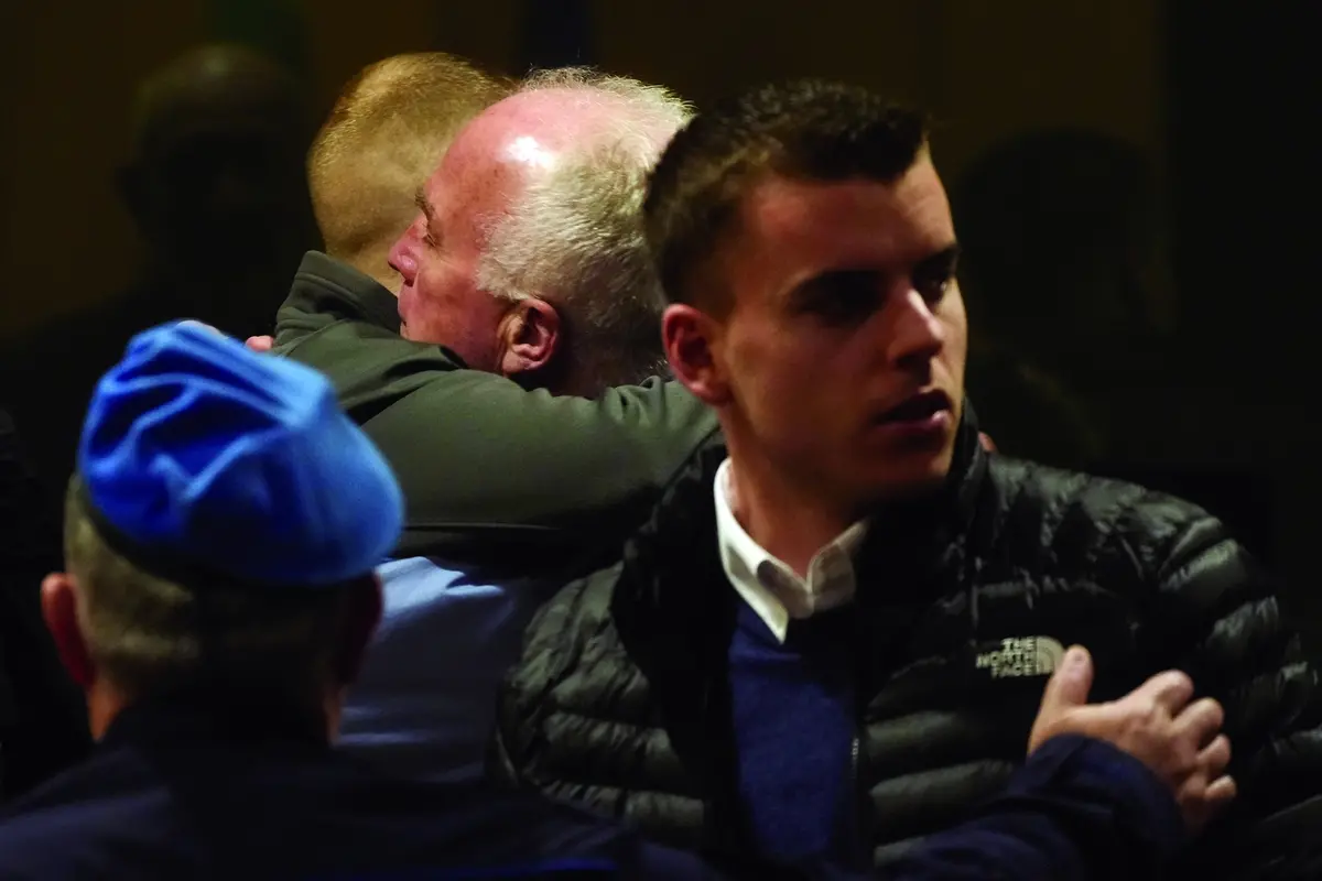 Ethan Elder, right, greets Finnegan Lee Elder, at the end of a hearing for the appeal trial in which his son and co-defendant Gabriel Natale-Hjorth, foreground right, are are facing murder charges for killing Italian Carabinieri paramilitary police officer Mario Cerciello Rega, in Rome, Friday, March. 8, 2024. The two American men face a new trial in the slaying of an Italian plainclothes police officer during a botched sting operation after Italy\\'s highest court threw out their convictions. (AP Photo/Gregorio Borgia) , AP