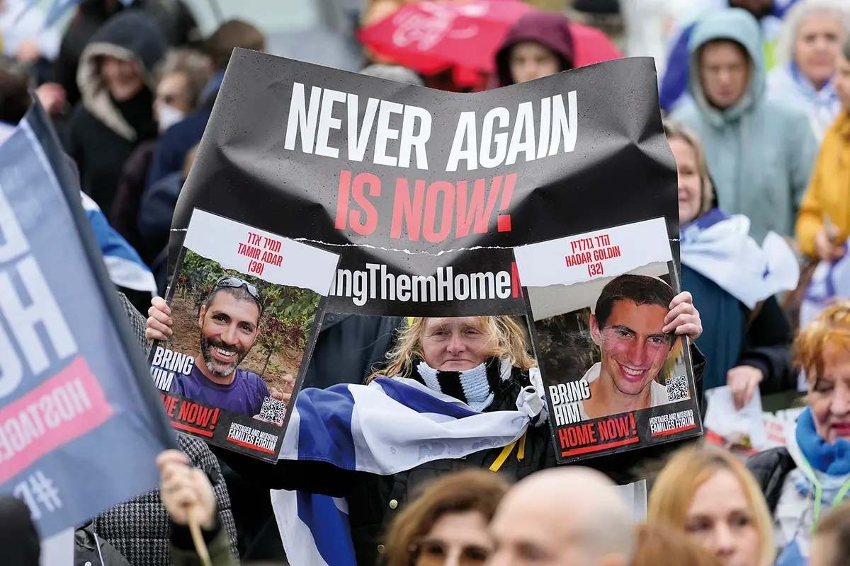 People attend a protest with families of hostages and former hostages from the Oct. 7 cross-border attack by Hamas on Israel, near the International Crime Court at The Hague, Netherlands, Wednesday, Feb. 14, 2024. The Hostages Families Forum together with the Raoul Wallenberg Center for Human Rights is submitting a comprehensive complaint to the International Criminal Court on behalf of released hostages and families of hostages, including the issuance of arrest warrants for Hamas leaders on war crimes allegations including taking hostages, enforced disappearances, sexual violence and torture. (AP Photo/Martin Meissner) Associated Press / LaPresse Only italy and Spain , APN