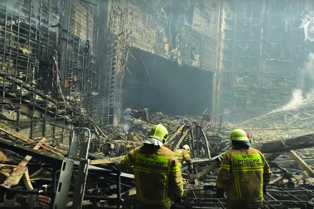 In this photo taken from video released by the Investigative Committee of Russia on Saturday, March 23, 2024, firefighter work in the burned concert hall after an attack on the building of the Crocus City Hall on the western edge of Moscow, Russia. Russia\\'s top state investigative agency says the death toll in the Moscow concert hall attack has risen to over 130. The attack Friday on Crocus City Hall, a sprawling mall and concert venue on Moscow\\'s western edge, also left many wounded and left the building a smoldering ruin. (Investigative Committee of Russia via AP) Associated Press / LaPresse Only italy and spain , APN