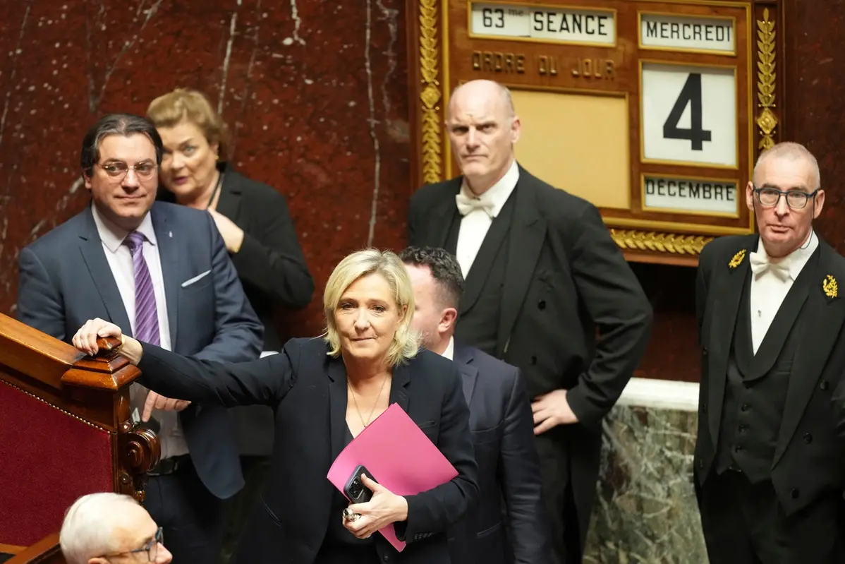 French far-right leader Marine Le Pen arrives to deliver her speech at the National Assembly prior to a no-confidence vote that could bring down the Prime Minister and the government for the first time since 1962, Wednesday, Dec. 4, 2024 in Paris. (AP Photo/Michel Euler) , APN