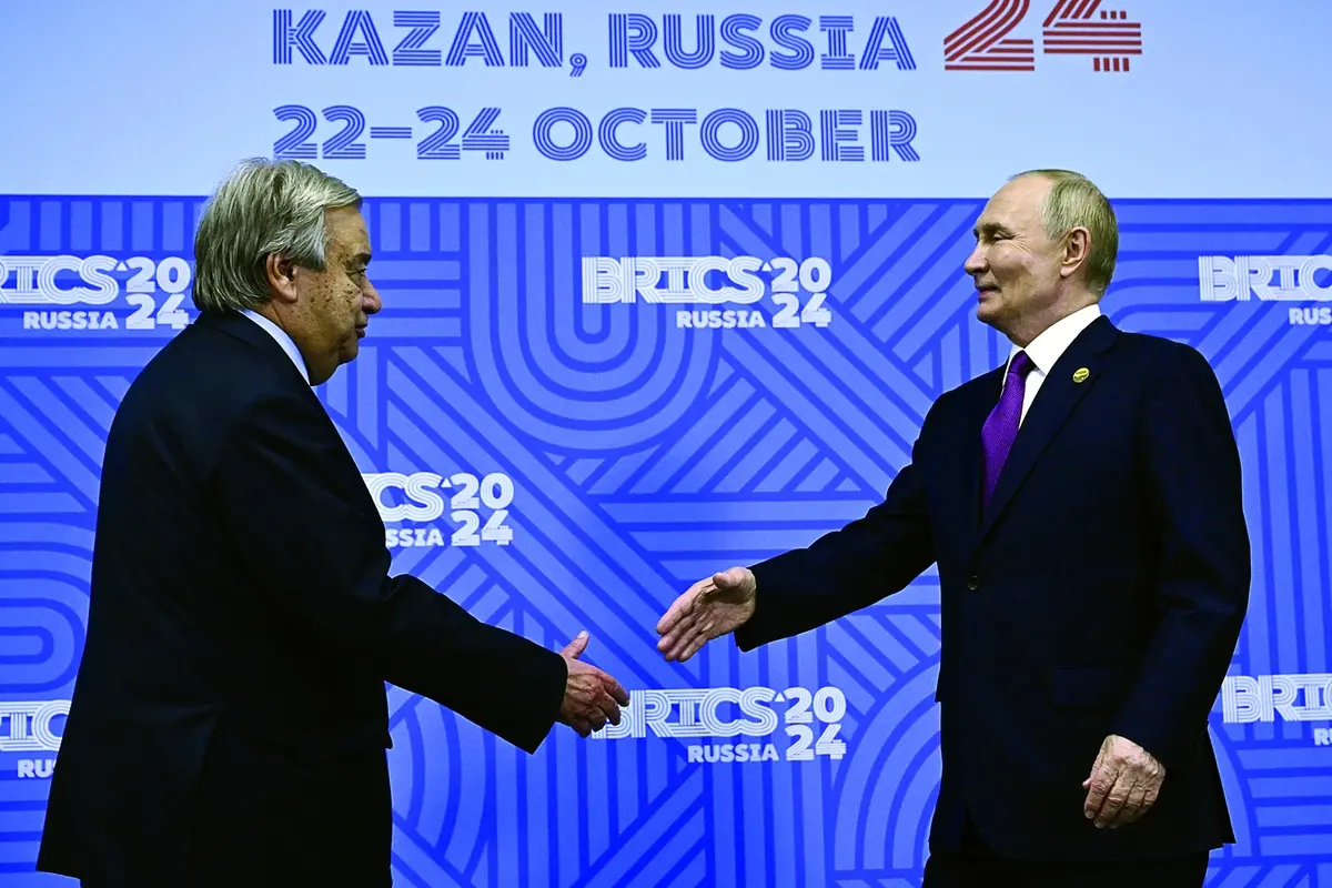 Russian President Vladimir Putin, right, greets United Nations (UN) Secretary General Antonio Guterres during their bilateral meeting on the sidelines of the BRICS summit in Kazan, Russia, Thursday, Oct. 24, 2024. (Alexander Nemenov, Pool Photo via AP)