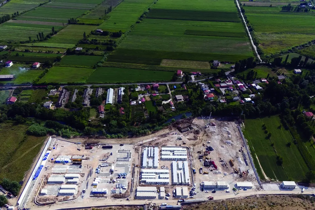 A migrant center is seen from above in Gjader, northwest Albania, Thursday, July 25, 2024. Migrants rescued at sea while attempting to reach Italy are likely to see themselves transported to Albania from next month while their asylum claims are processed, under a controversial deal in which the small Balkan country will host thousands of asylum-seekers on Italy\\\\\\'s behalf. (AP Photo/Vlasov Sulaj) Associated Press / LaPresse Only italy and Spain , APN