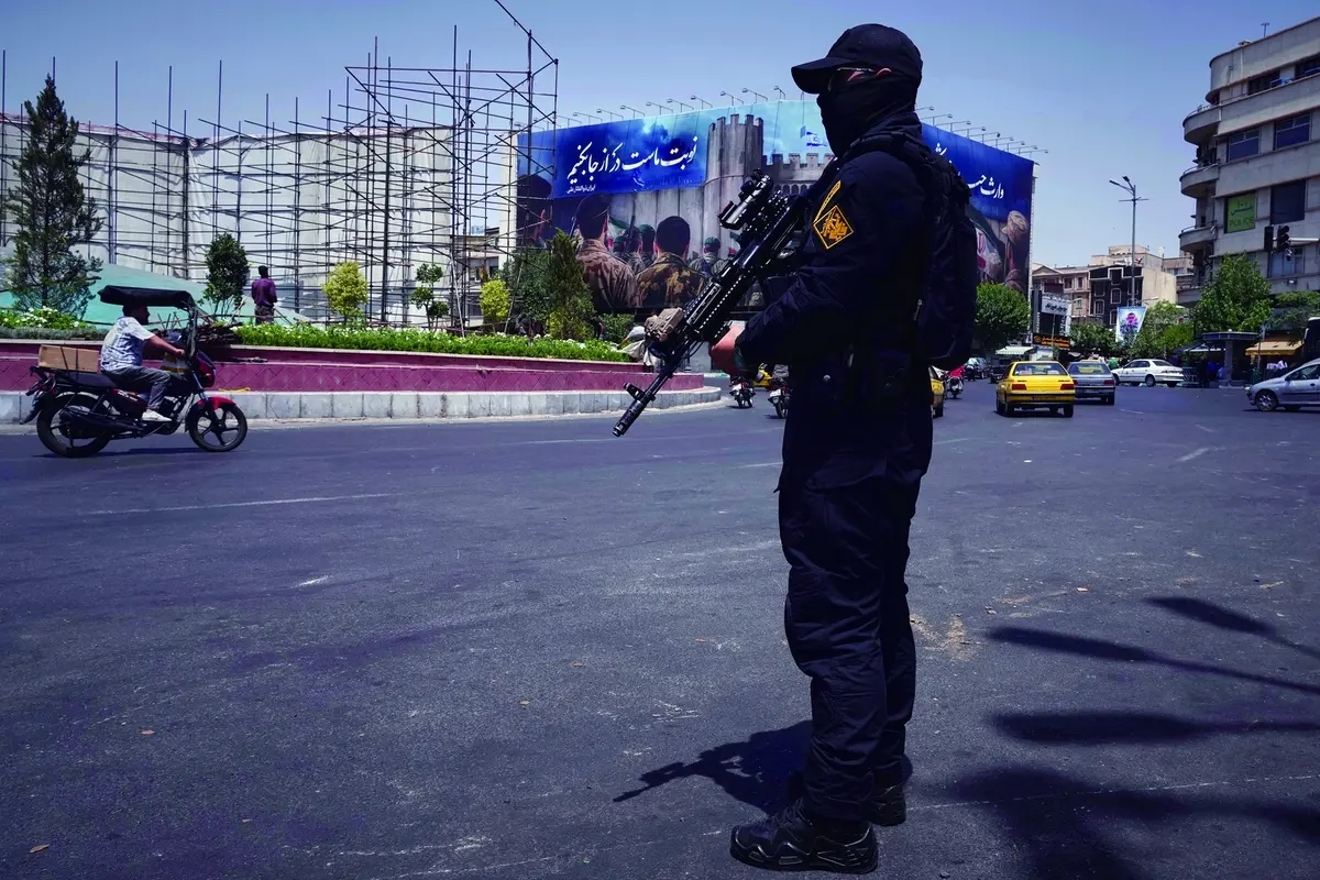 A member of Iran\\'s Revolutionary Guard stands guard at Enqelab-e-Eslami (Islamic Revolution) square in downtown Tehran, Iran, Tuesday, June 24, 2025. (AP Photo/Vahid Salemi) Associated Press/LaPresse , APN
