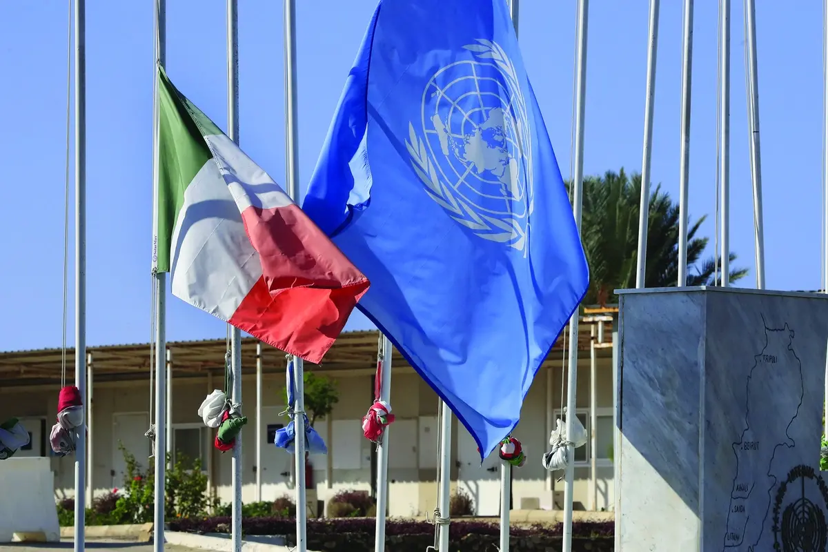 FILE - The United Nations and the Ireland flags fly at half-staff, at the UNIFIL headquarters in the southern Lebanese town of Naqoura, Lebanon, on Dec. 16, 2022 Four United Nations military observers were wounded Saturday while patrolling along the southern Lebanese border after a shell exploded near them, the U.N. peacekeeping mission in southern Lebanon said. The military observers of the United Nations Truce Supervision Organization support the U.N. peacekeeping mission in southern Lebanon, UNIFIL. (AP Photo/Mohammed Zaatari, File) , AP