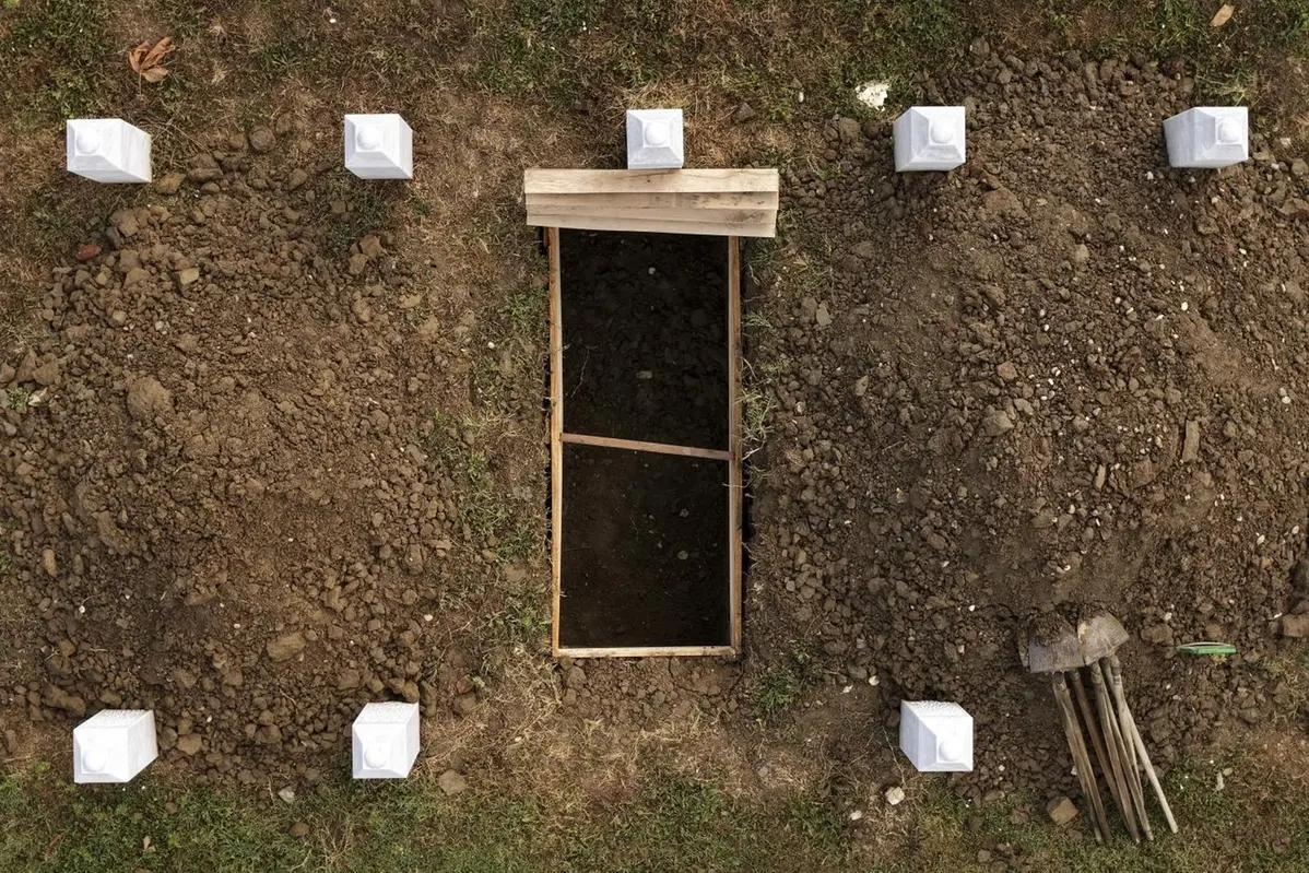 An aerial view of the Srebrenica Genocide Memorial Center and the newly dug grave is seen prior to the mass burial ceremony in Potocari, Bosnia, Thursday, July 10, 2025. (AP Photo/Armin Durgut) , APN