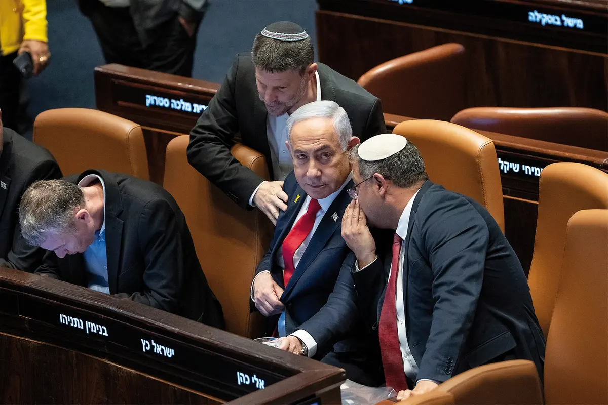 Israel\\\\\\'s Prime Minister Benjamin Netanyahu, center, surrounded by ministers from the government attends a session of the Knesset, Israel\\\\\\'s parliament, in Jerusalem. Monday Nov. 18, 2024. (AP Photo/Ohad Zwigenberg)